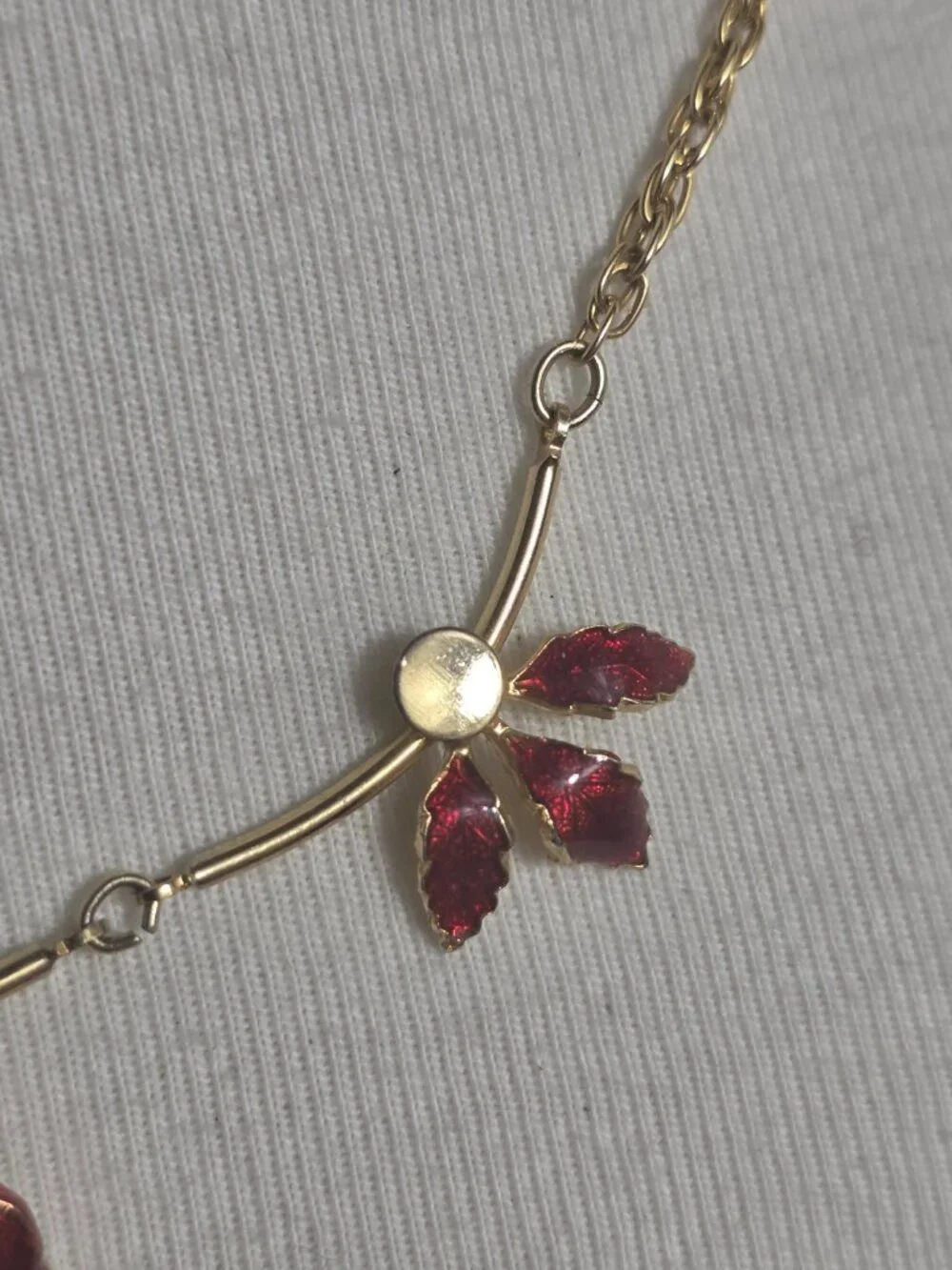Delicate Gold-Tone Necklace Three Red Enamel Leaf Motifs Along Rigid Gold Bars